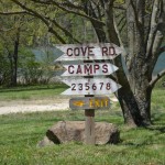 Cove Campground Signs pointing left and right to different camp areas
