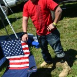 Wounded Veteran John Patterson sports a red Tread Lightly 4W2H T-shirt