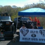 The 4 Wheel to Heal booth setup with the "Mauler" right next to it