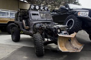A jeep with armor and a plow